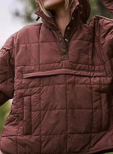 Rust brown cozy oversized puffer jacket with hood, designed for casual layering and comfort.