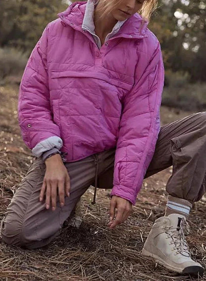 Bright pink cozy oversized puffer jacket with hood, designed for casual layering and comfort.