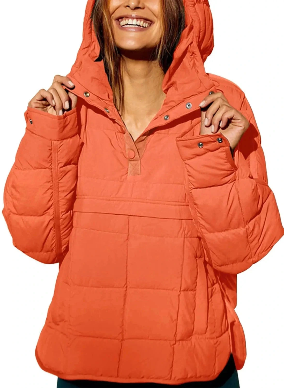 Cozy oversized puffer jacket in coral orange with a hooded design, perfect for casual layering.