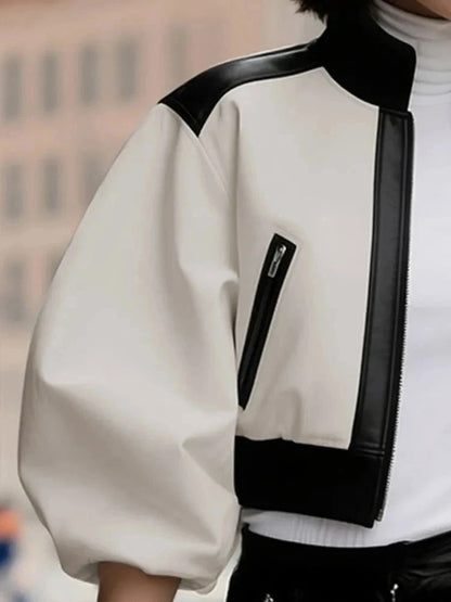 Cropped puff sleeve stand collar jacket with contrast color and zipper closure, made from a PU leather blend.