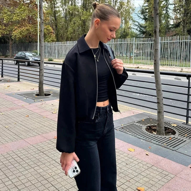 Cropped puffed bomber jacket with relaxed fit and zipper closure, made from quality polyester.