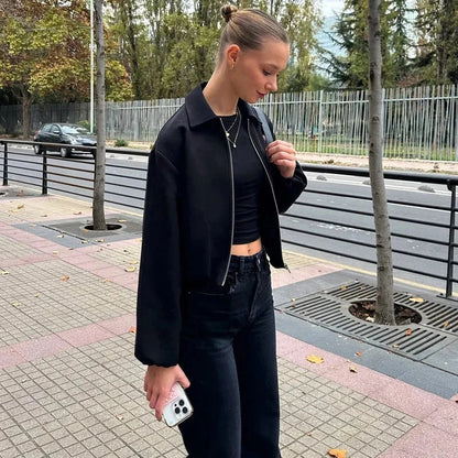 Cropped puffed bomber jacket with relaxed fit and zipper closure, made from quality polyester.