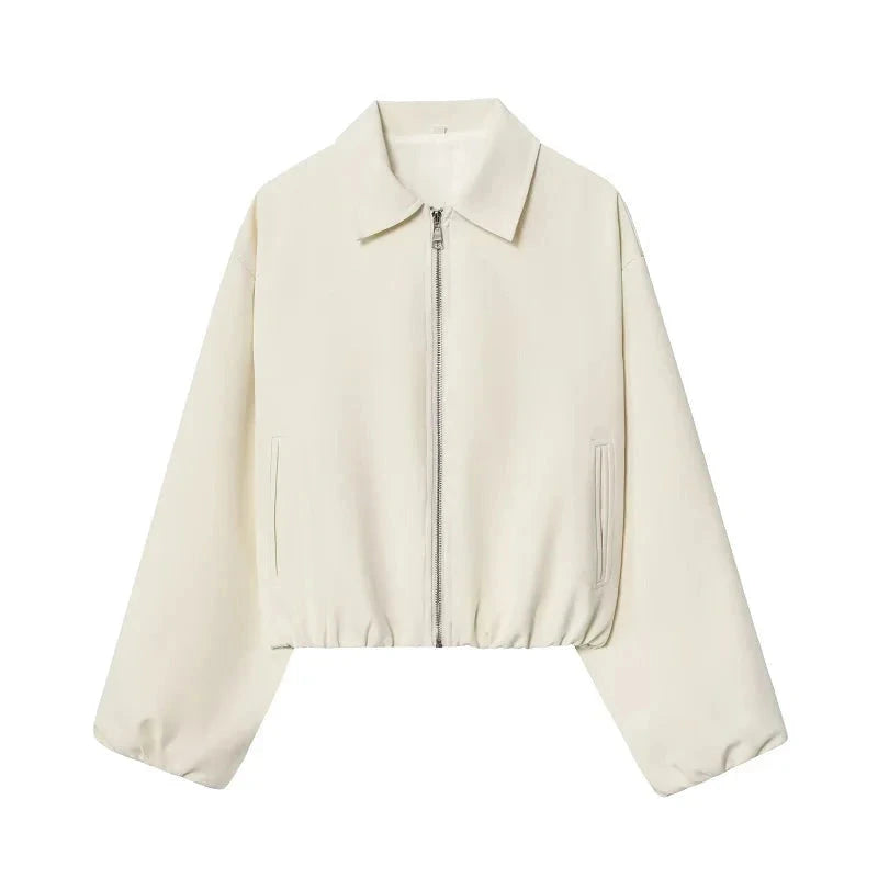 Cropped puffed bomber jacket in cream beige with a relaxed fit and zipper closure, made from quality polyester.