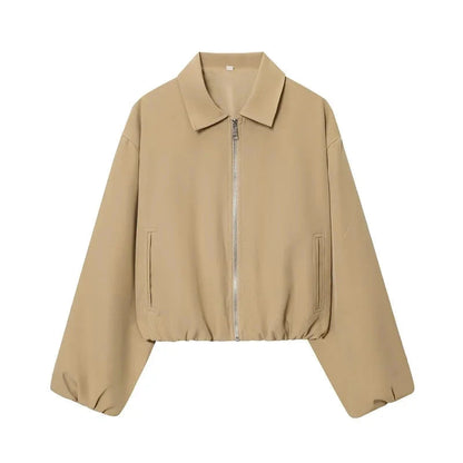 Cropped puffed bomber jacket in soft beige with a relaxed fit and zipper closure. Ideal for casual outfits.