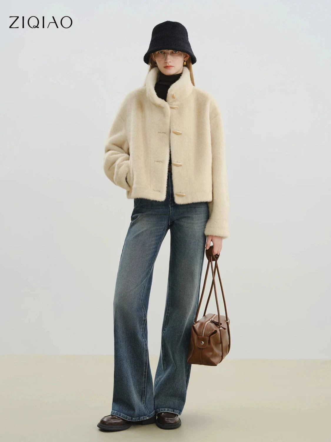 Chic eco-friendly short faux leather fur coat with toggle buttons, crafted from 100% polyester. Suitable for office wear.