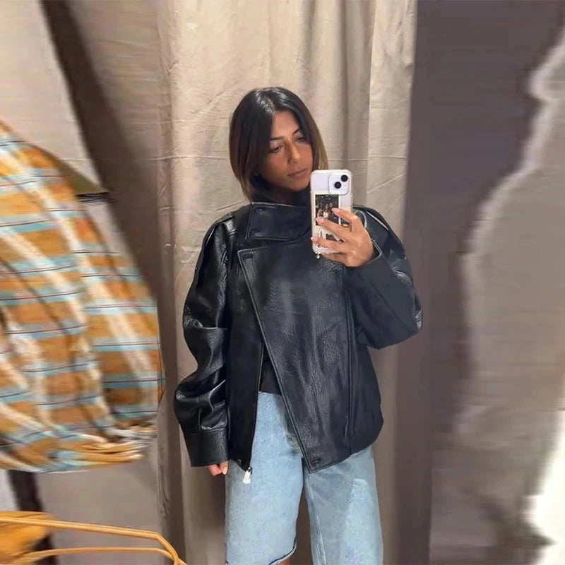 Chic short leather jacket with polished finish, stand collar, and zipper closure in relaxed fit. Perfect for casual wear.