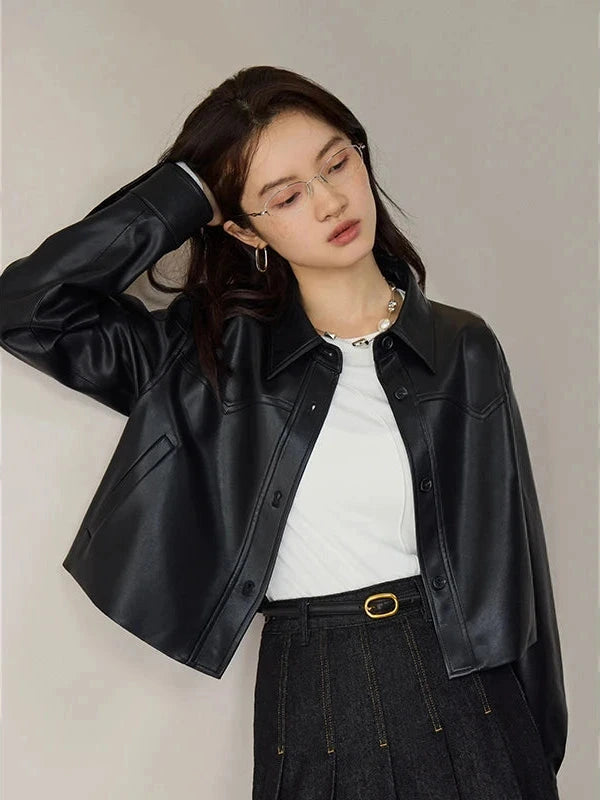 Chic short leather jacket in deep black with single breasted closure and short length design.