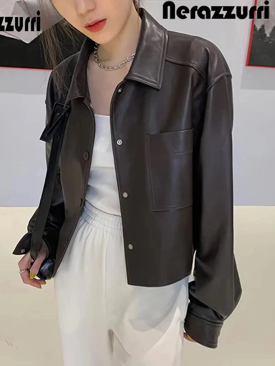 Chic short faux leather jacket with a loose fit, single-breasted design, and functional pockets.