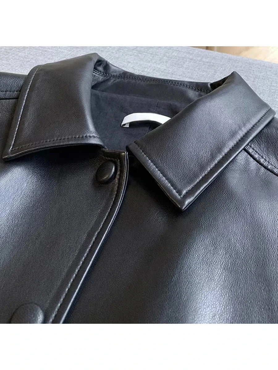 Chic short faux leather jacket with a loose fit, single-breasted design, and functional pockets.