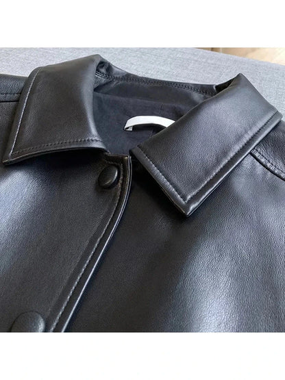 Chic short faux leather jacket with a loose fit, single-breasted design, and functional pockets.