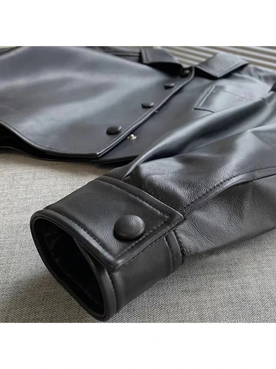 Chic short faux leather jacket with a loose fit, single-breasted design, and functional pockets.