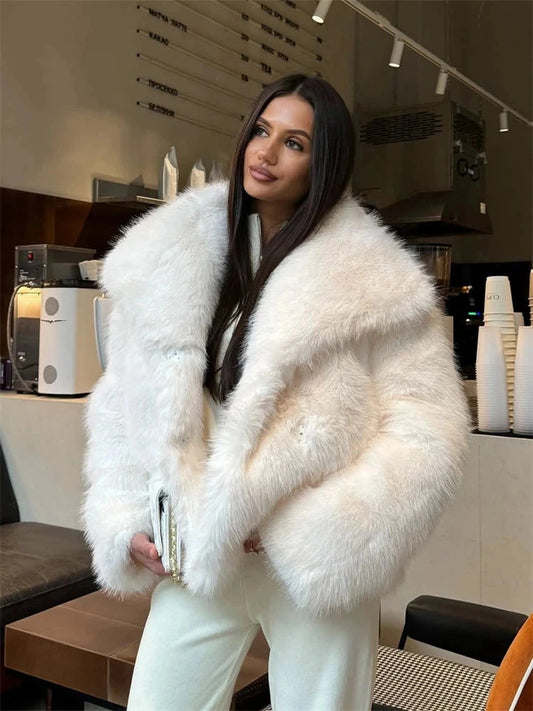 Cropped luxurious faux leather fur coat with a chic lapel design and cozy fluffy texture for winter wear.