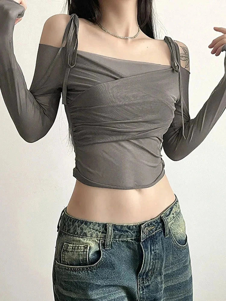 Chic off-shoulder crop top in solid design made from a cotton and polyester blend with high-stretch mesh fabric.