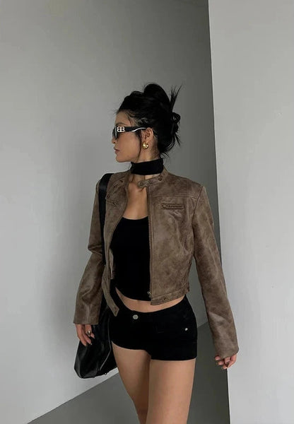 Black stand collar leather jacket with zip closure and side pockets, displayed on a neutral background.