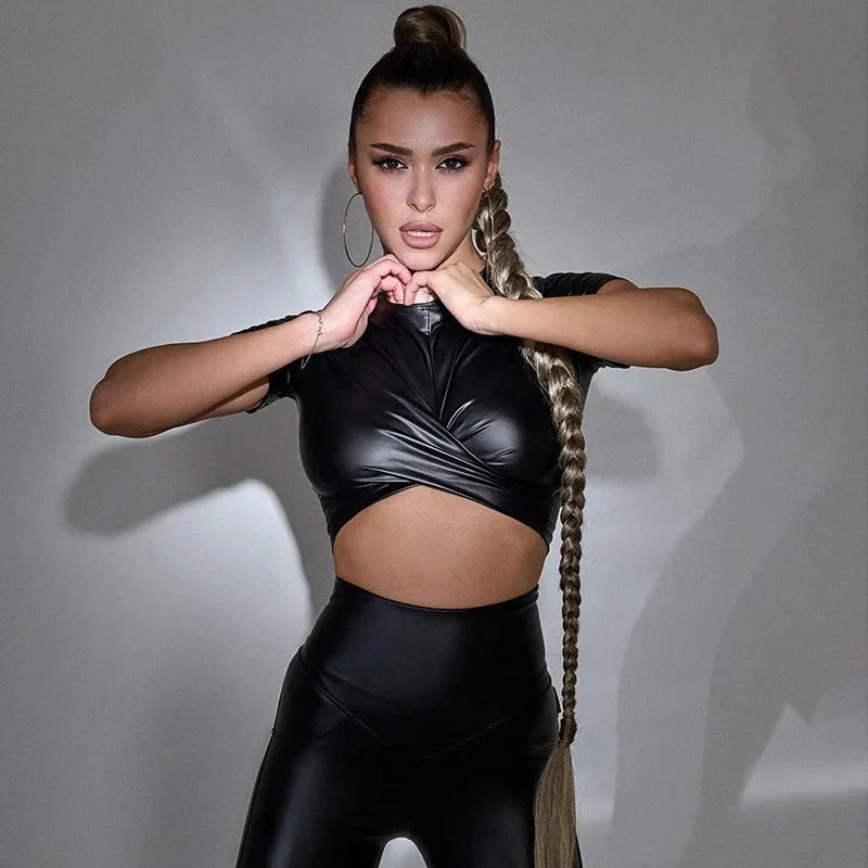 Chic cropped PU leather tank top with a sleek finish, perfect for layering or summer outings.