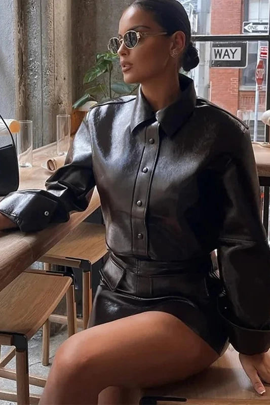 Refined leather jacket and mini skirt ensemble with single-breasted closure and turn-down collar, made from polyester.