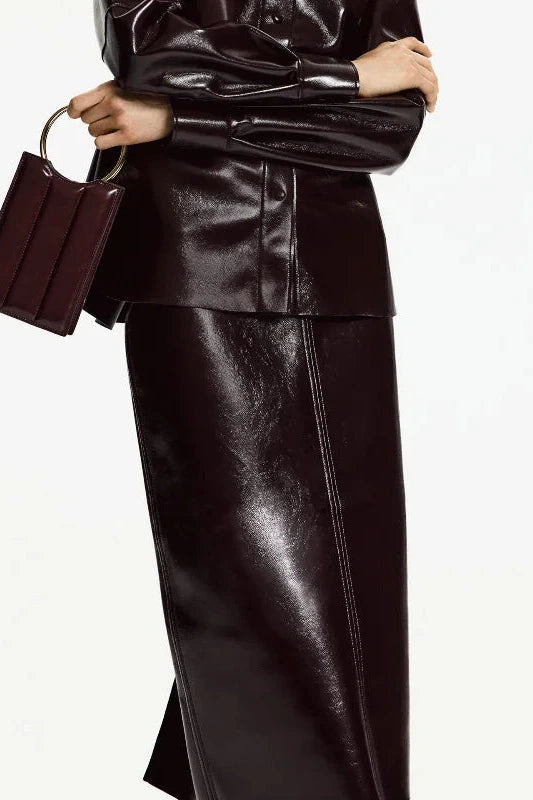 Refined leather jacket and mini skirt ensemble with single-breasted closure and turn-down collar, made from polyester.