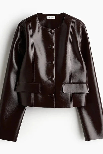 Refined leather jacket and mini skirt ensemble in espresso brown, featuring a single-breasted closure and turn-down collar.