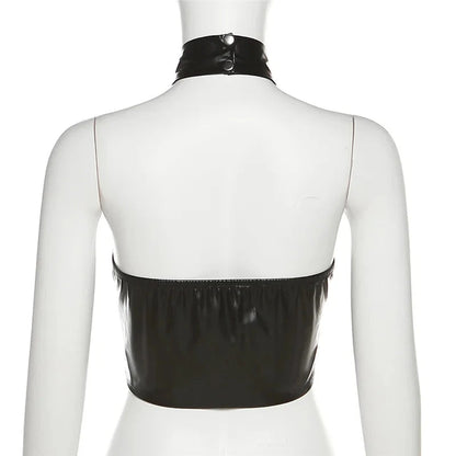 Sleek black halter crop top in PU leather with backless design and midriff-baring silhouette.