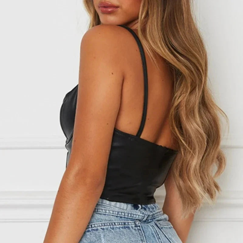 Sleek halter neck cropped tank top in PU leather with a slim fit and sleeveless design. Ideal for casual or night out styling