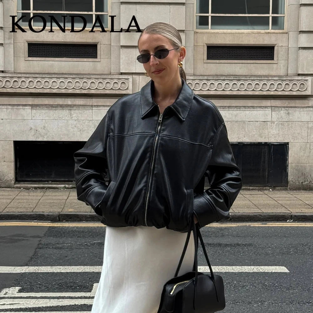 Chic vintage spliced zipper faux leather jacket with turn-down collar and full sleeves. Regular fit for versatile styling.