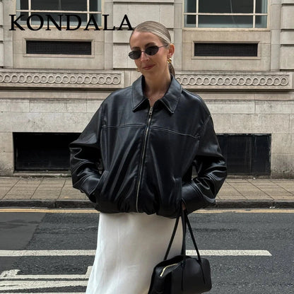 Chic vintage spliced zipper faux leather jacket with turn-down collar and full sleeves. Regular fit for versatile styling.