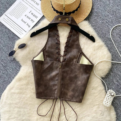 Chic black PU leather crop top with rope straps and hollow-out design, featuring a fitted silhouette and super-short length.