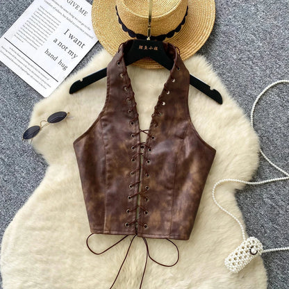 Chic black PU leather crop top with rope straps and hollow-out design, featuring a fitted silhouette and super-short length.