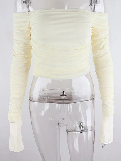Elegant off-shoulder ruched crop top with mesh detail, featuring full sleeves and a slim fit design.