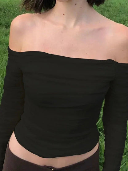 Elegant off-shoulder ruched crop top with mesh detail in midnight black, featuring full sleeves and a slim fit.