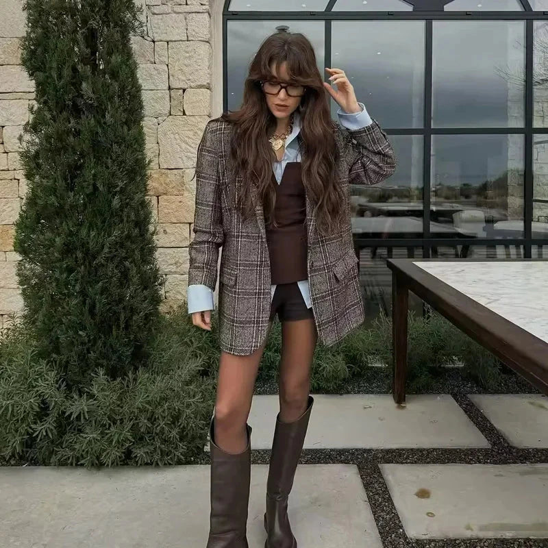 Strapless off-white crop top with backless design and corset silhouette made from lightweight polyester.