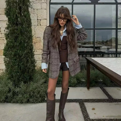 Strapless off-white crop top with backless design and corset silhouette made from lightweight polyester.