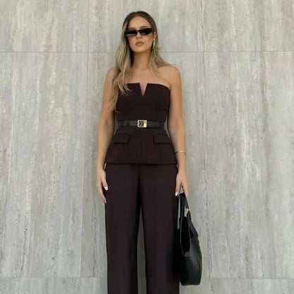 Strapless off-white crop top with backless design and corset silhouette made from lightweight polyester.