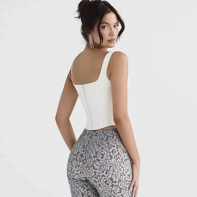 Backless halter neck stretch bandage top made from a polyester and spandex blend, designed for a sleek silhouette.