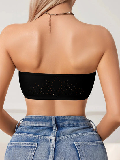 Strapless push-up bandeau bra with seamless design and front closure, crafted from soft polyamide for comfort.