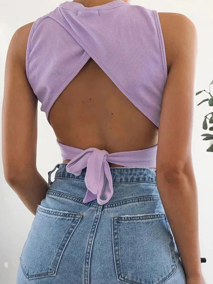 Chic backless criss-cross tank top in soft cotton blend with a slim fit and short length, ideal for casual summer wear.