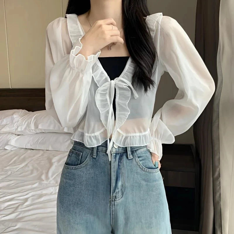 Chic ruffled chiffon cape with long sleeves, lightweight polyester blend, open stitch design, and regular fit.