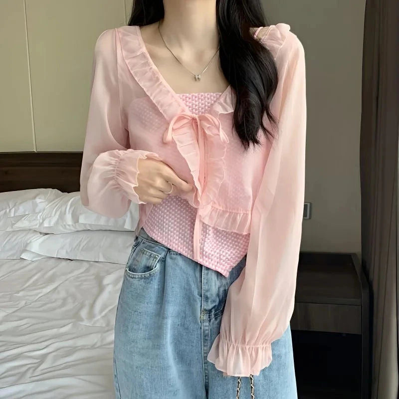 Chic ruffled chiffon cape with long sleeves, featuring an open stitch design and lightweight polyester blend fabric.