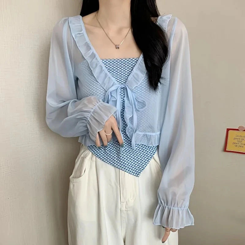 Chic ruffled chiffon cape with long sleeves, lightweight polyester blend, open stitch design, and regular fit.