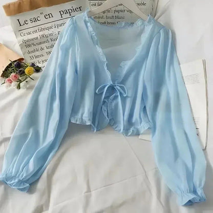 Sky blue ruffled chiffon cape with long sleeves and open stitch design, perfect for layering over dresses or tops.