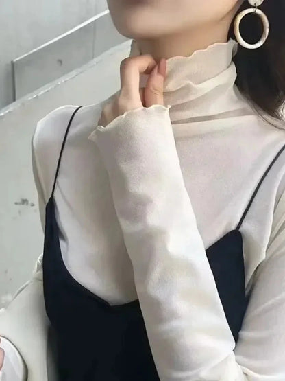 Sheer long sleeve turtleneck lace crop top in cream white with a slim fit and lightweight design.