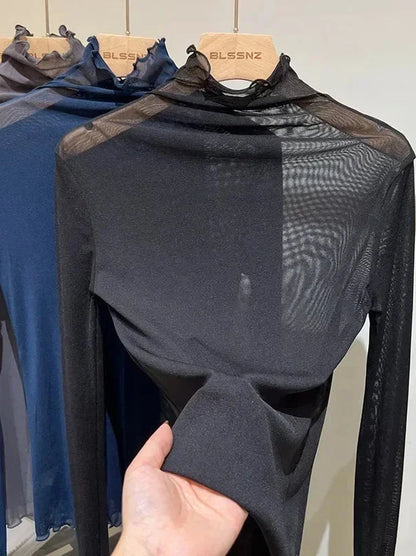 Sheer long sleeve turtleneck lace crop top in deep black with a slim fit and lightweight design.