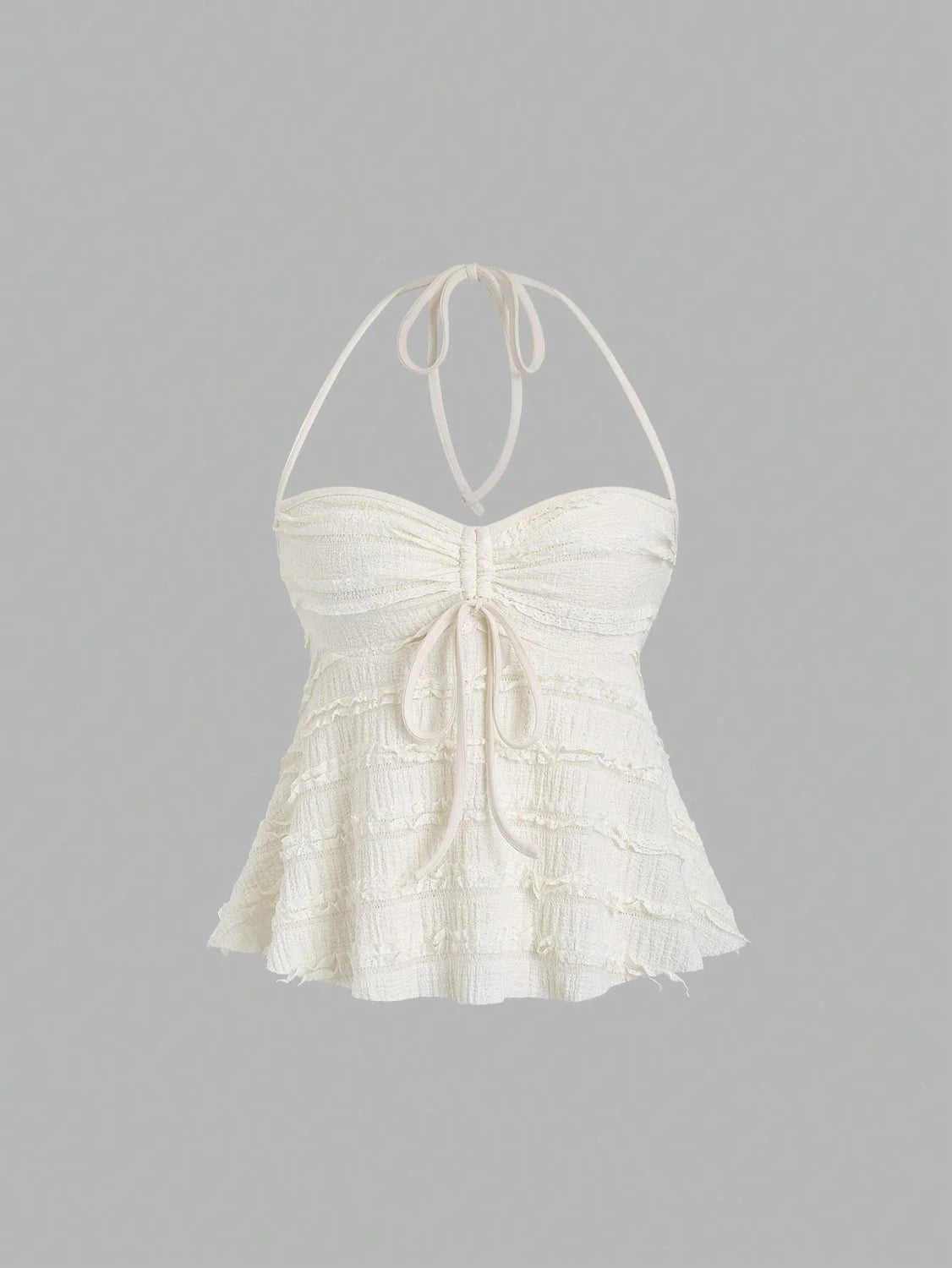 Textured halter neck knitted vest top with drawstring detail and backless design in a soft apricot hue.