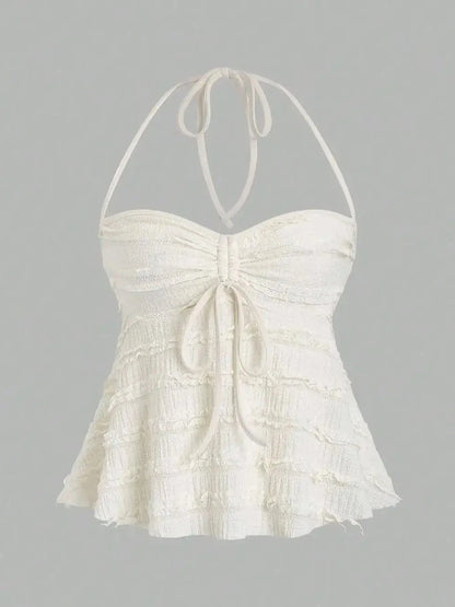 Textured apricot halter neck knitted vest top with drawstring detail and backless design. Suitable for casual summer wear.