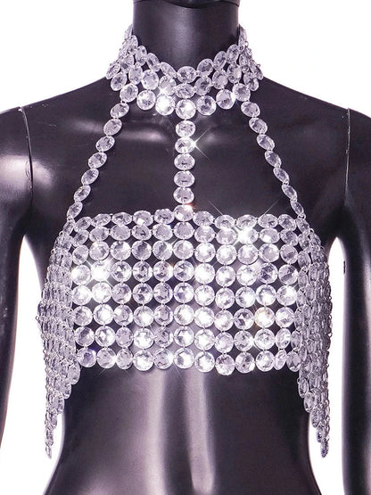 Silver halter tank top with glittering sequin detail and backless design, perfect for clubwear and festive occasions.