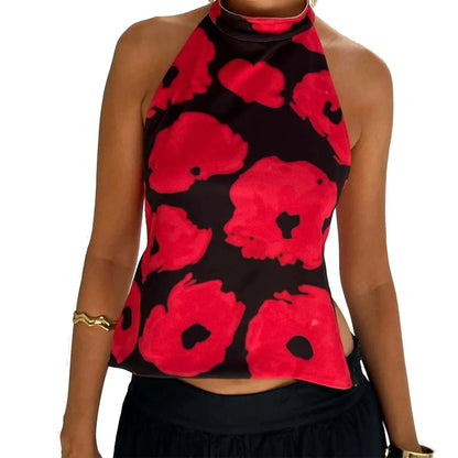 Elegant sleeveless halter top with polka dot print in a cotton polyester blend. Regular length with slight stretch.