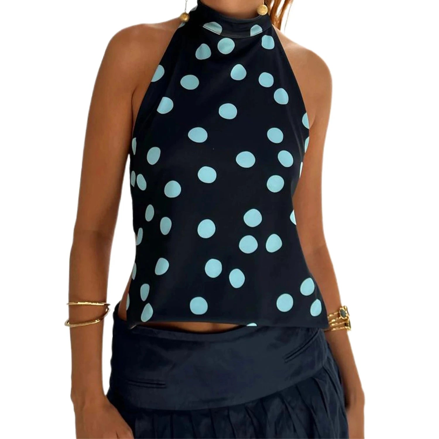 Elegant sleeveless halter top with polka dot print in a cotton polyester blend. Regular length and slight stretch.