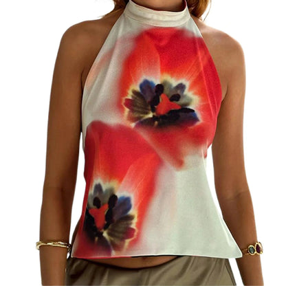 Elegant sleeveless halter top with polka dot print in a cotton polyester blend. Regular length with slight stretch.