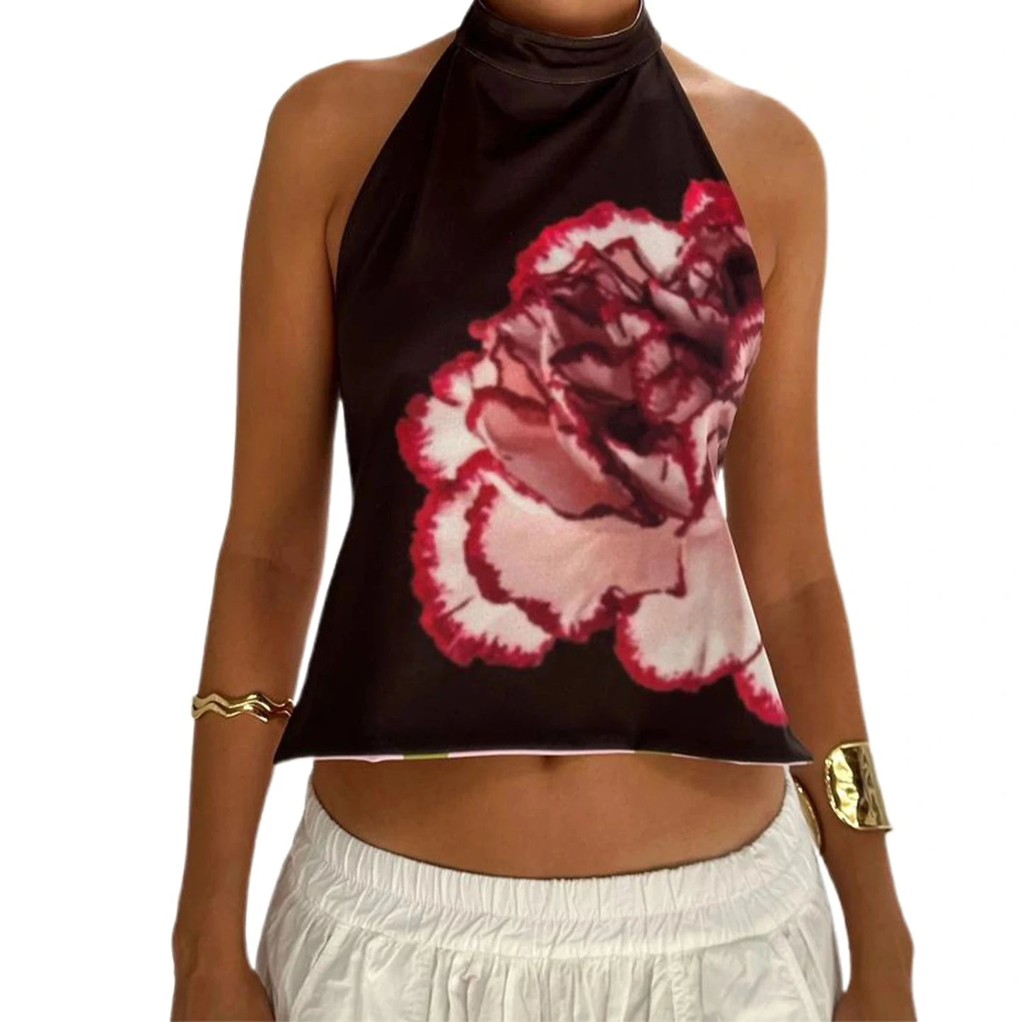 Elegant sleeveless halter top with polka dot print in a cotton polyester blend, perfect for casual outings and parties.