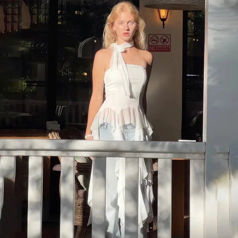 Chic off-shoulder crop top in white with a halter neckline and sleeveless design, made from lightweight polyester.